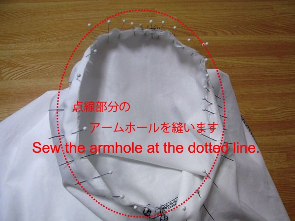 Sewing along the armhole after placing all marking pins on the sleeve