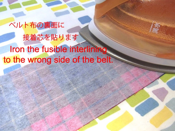 Ironing fusible interlining onto the back of the belt cloth