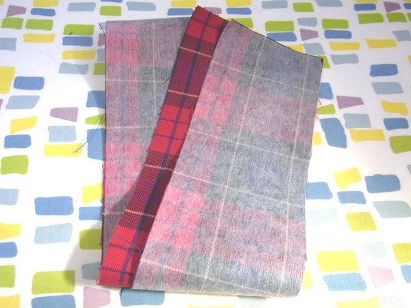 Fusible interlining applied to the reverse side of the belt cloth