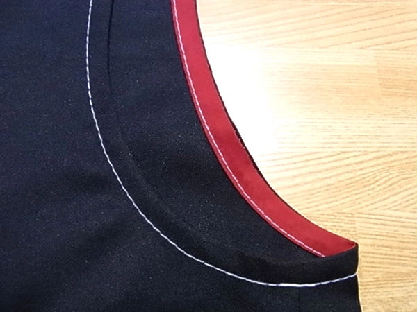 Completed armhole seam allowance finished with bias tape