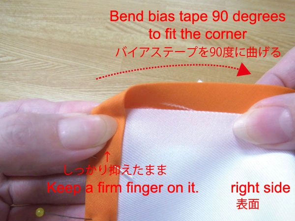 Bend the bias tape 90 degrees to fit the corner