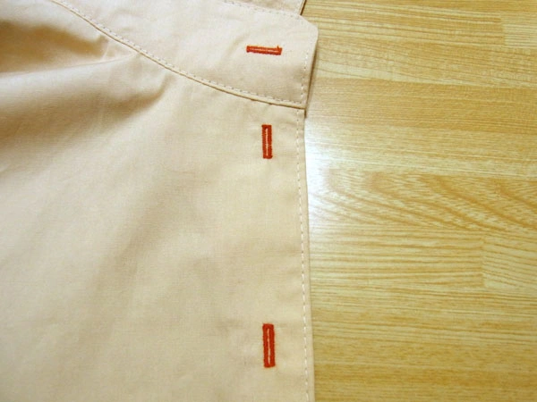 Completed buttonholes on a shirt