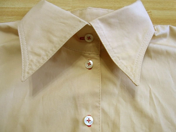 Checking alignment of buttonholes and buttons