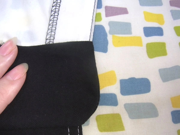 Preparing to iron folded edge of collar stand