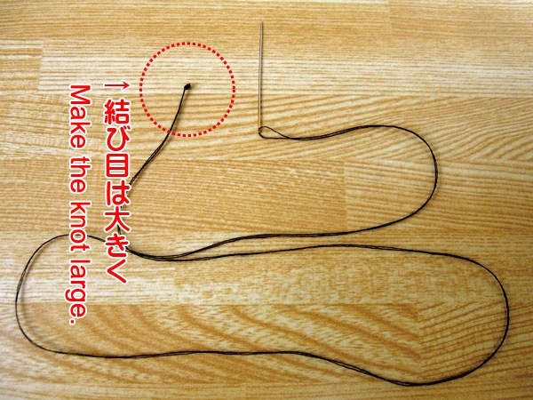 Running stitch around fur fabric for making a furry bulb