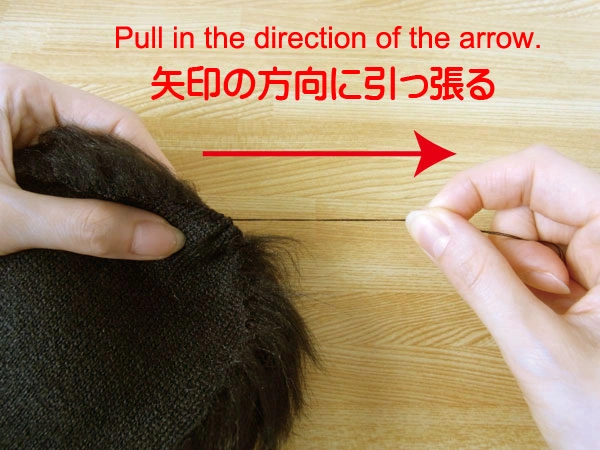Pulling thread to gather fur fabric into a round shape