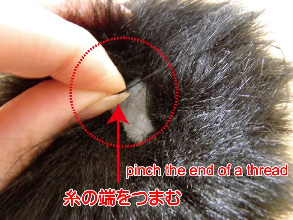 Closing the furry bulb tightly with thread