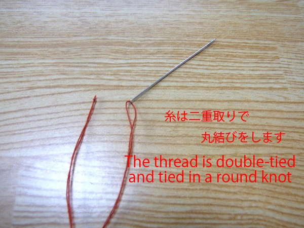 Preparing needle and thread for sewing snaps