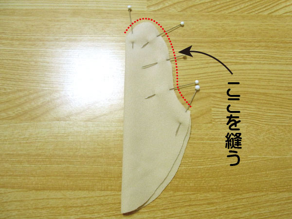 Pinning the thumb piece for glove sewing