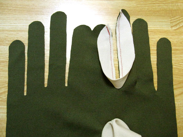 Index and middle finger gussets sewn onto glove