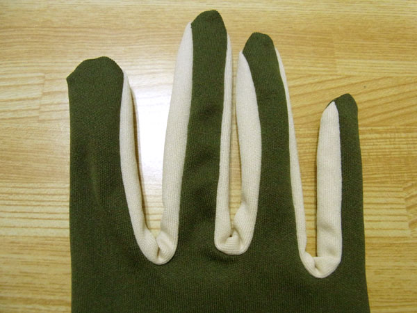 Checking glove fingertip openings and seams