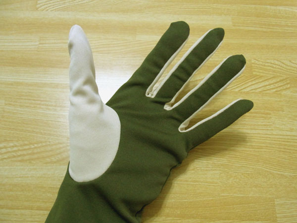 Trying on finished handmade gloves