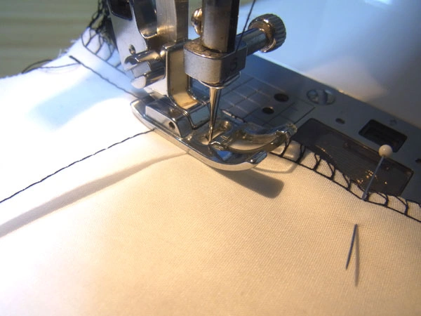 Serging shoulder and side seams of blouse