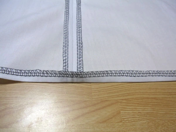 Overlocked hem ready for ironing
