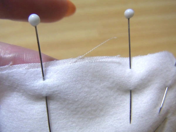 Pinning facing fabric with shifted seam