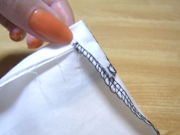 Folding blouse hem along seam line