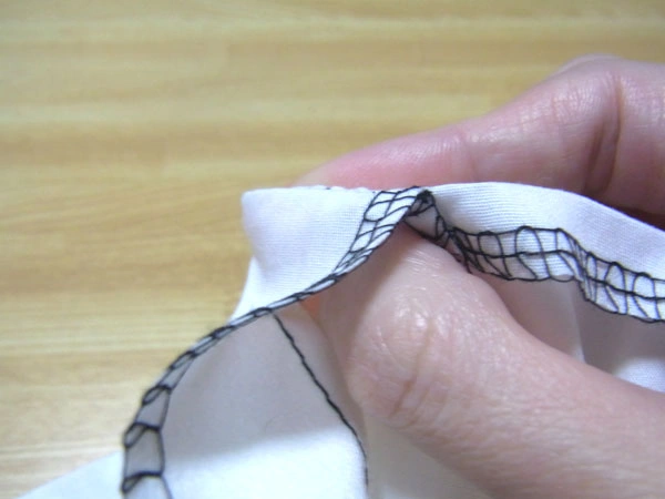 Turning hem corners inside out