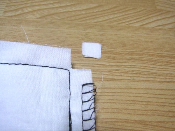 Dropped corner hem finish for medium fabrics