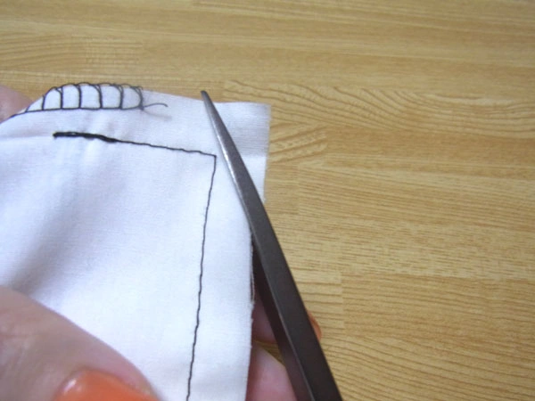 Diagonal cutting of hem corners