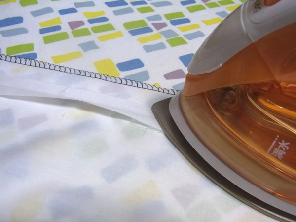Ironing facing seam allowance open at corners