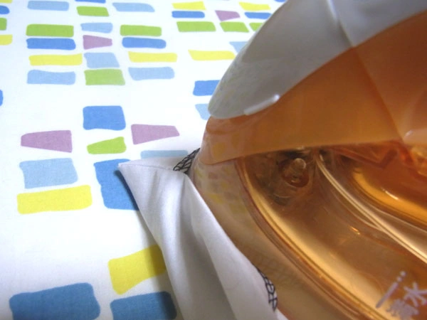 Pressing facing seam allowance with iron