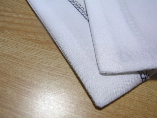 Blouse hem seam pressed from facing side