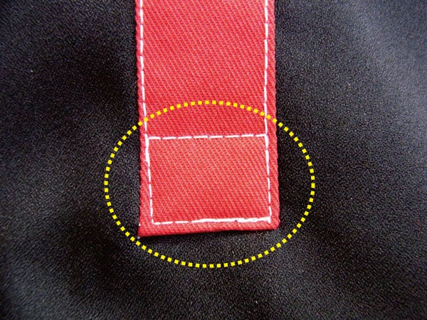 Stitching where the two front fly pieces are joined