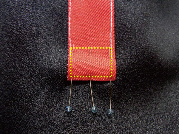 Sewing along the white dotted line to secure the triangle