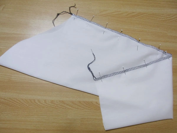 Ironing sleeve edges after serging