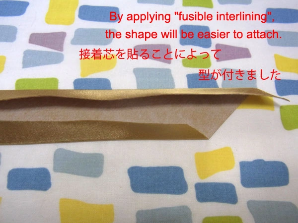 Golden satin bias tape holding shape better with fusible interlining